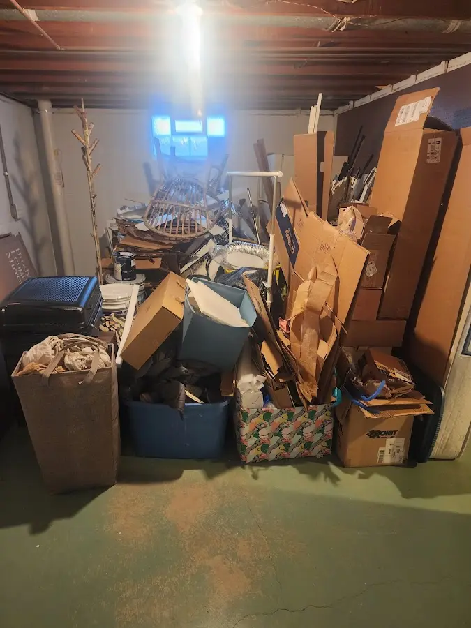 Roll-off dumpster container at job site for 2 Yard Dumpster Rental in Charlton