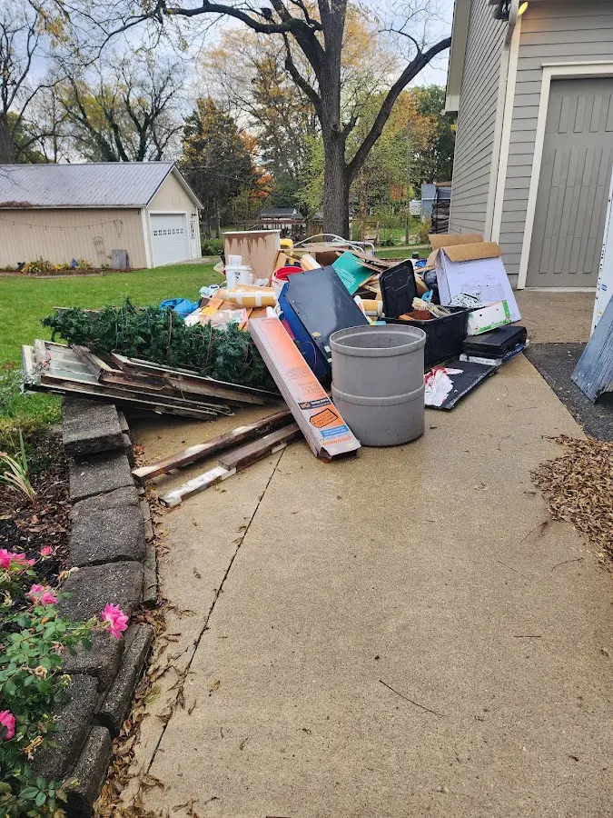 Dumpster being loaded with debris for 10 Yard Dumpster Rental in Charlton